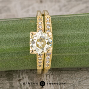 The "Alexandra" ring in 18k yellow gold with 1.17-Carat Diamond alongside the "Alexandra" band in 18k yellow gold