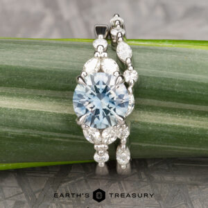 The "Cattleya" in platinum with 2.29-carat Montana sapphire; alongside the "Cattleya" band in platinum