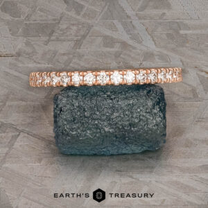 The petite pave diamond band in 14k rose gold, hammered and brushed