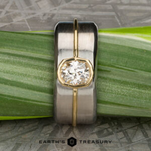 The "Perseus" ring in platinum and 18k yellow gold with custom-cut diamond