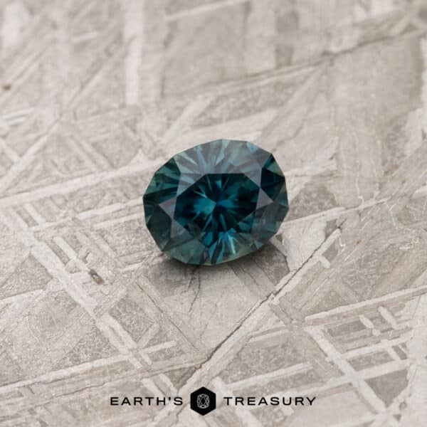 A blue-green Australian Sapphire in our "Helena" oval design