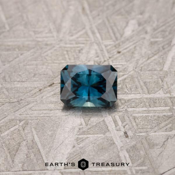 A blue-green Australian Sapphire in our "Fourth of July" rectangle design