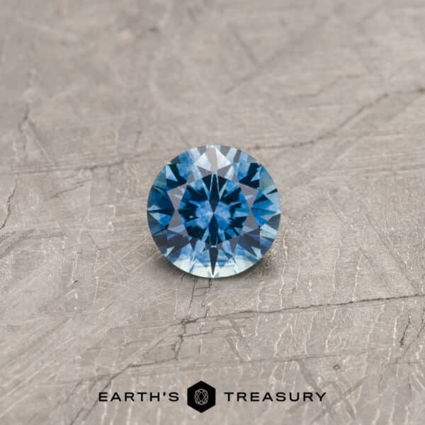 A blue Montana sapphire in a classic diamond round brilliant design