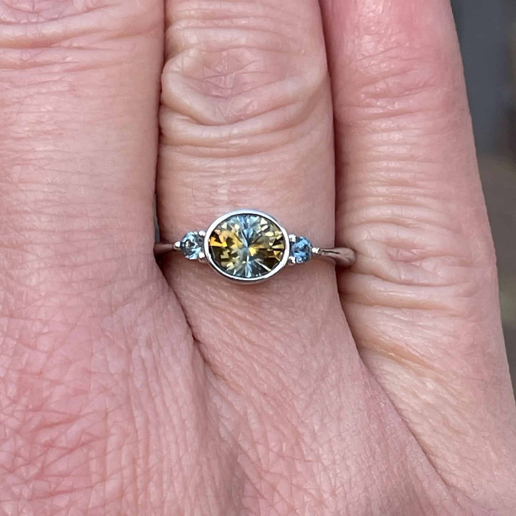 A photo from a customer review featuring a "Evadne" ring in 14k white gold with 1.34-Carat Montana Sapphire