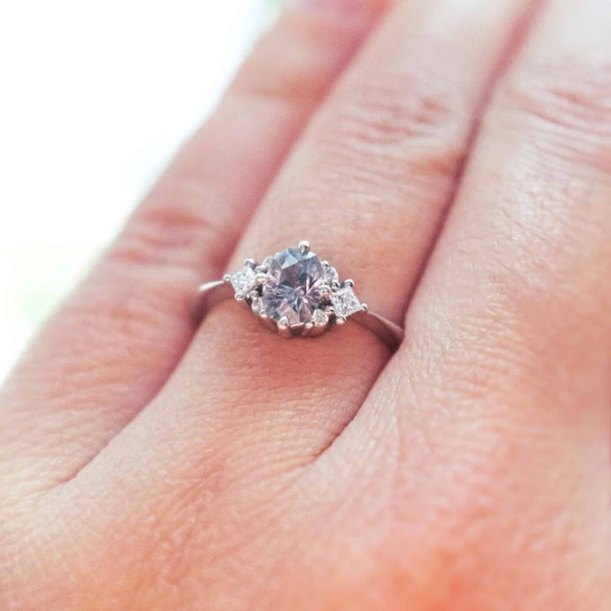 A photo from a customer review featuring a straight "Sappho" ring in 14k white gold with 0.86-Carat Montana Sapphire