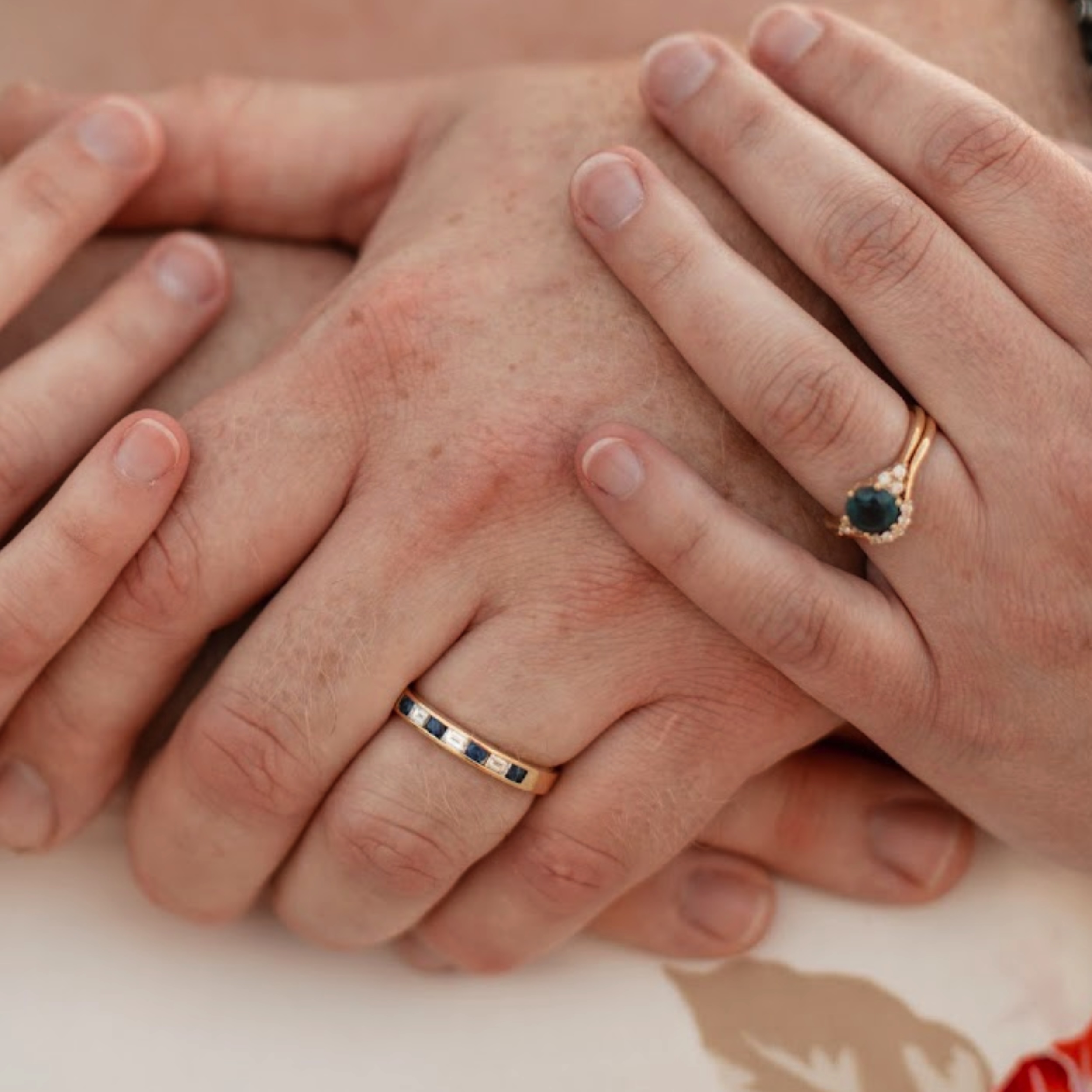 The "Mari" ring in 18k yellow gold with 1.76-Carat Montana Sapphire, the "Electra" band in 18k yellow gold, and the "Caspian" ring in 18k yellow gold