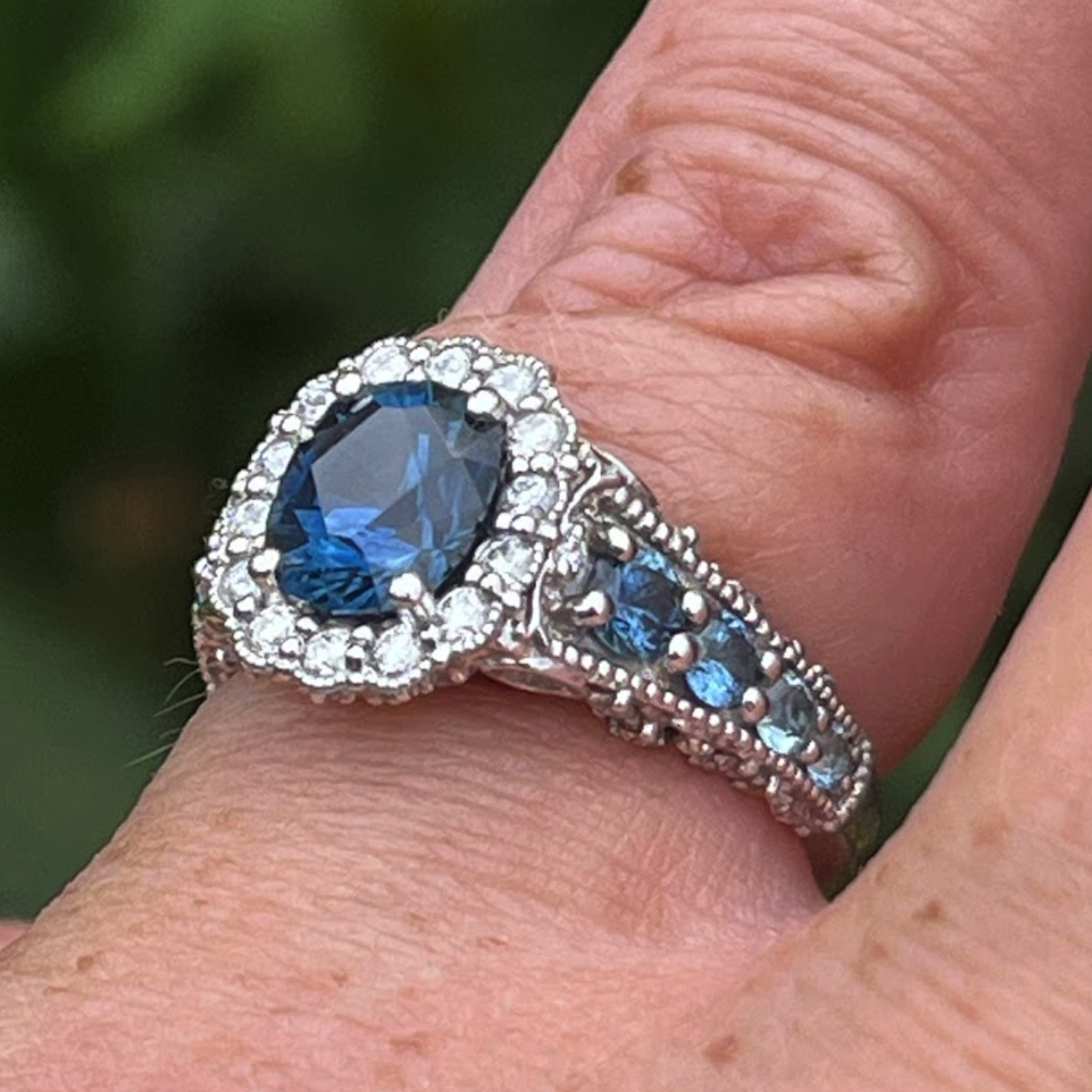 A custom halo ring in platinum with 1.88-carat Montana sapphire